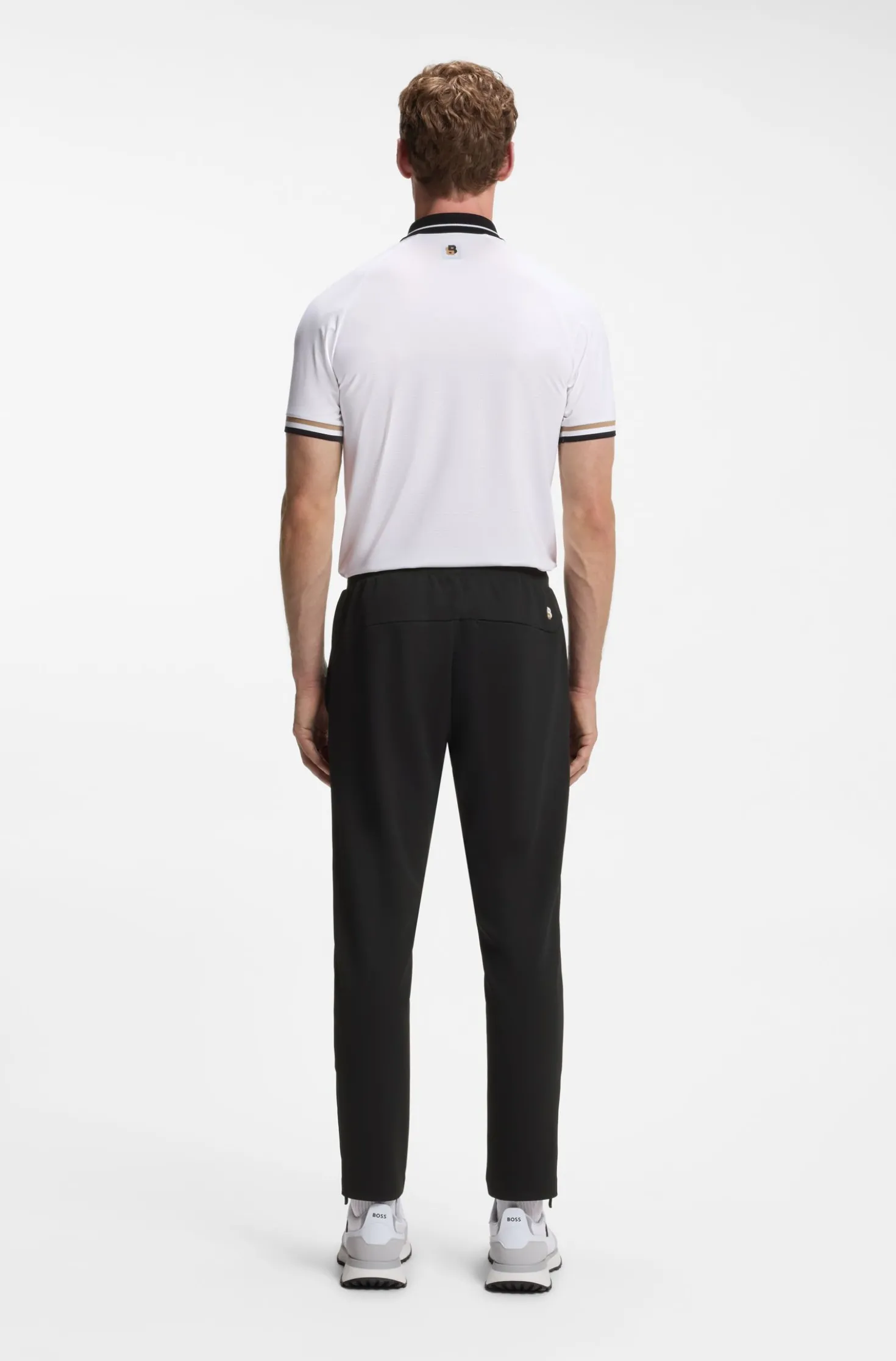 Active tracksuit bottoms in thermoregulating stretch gabardine