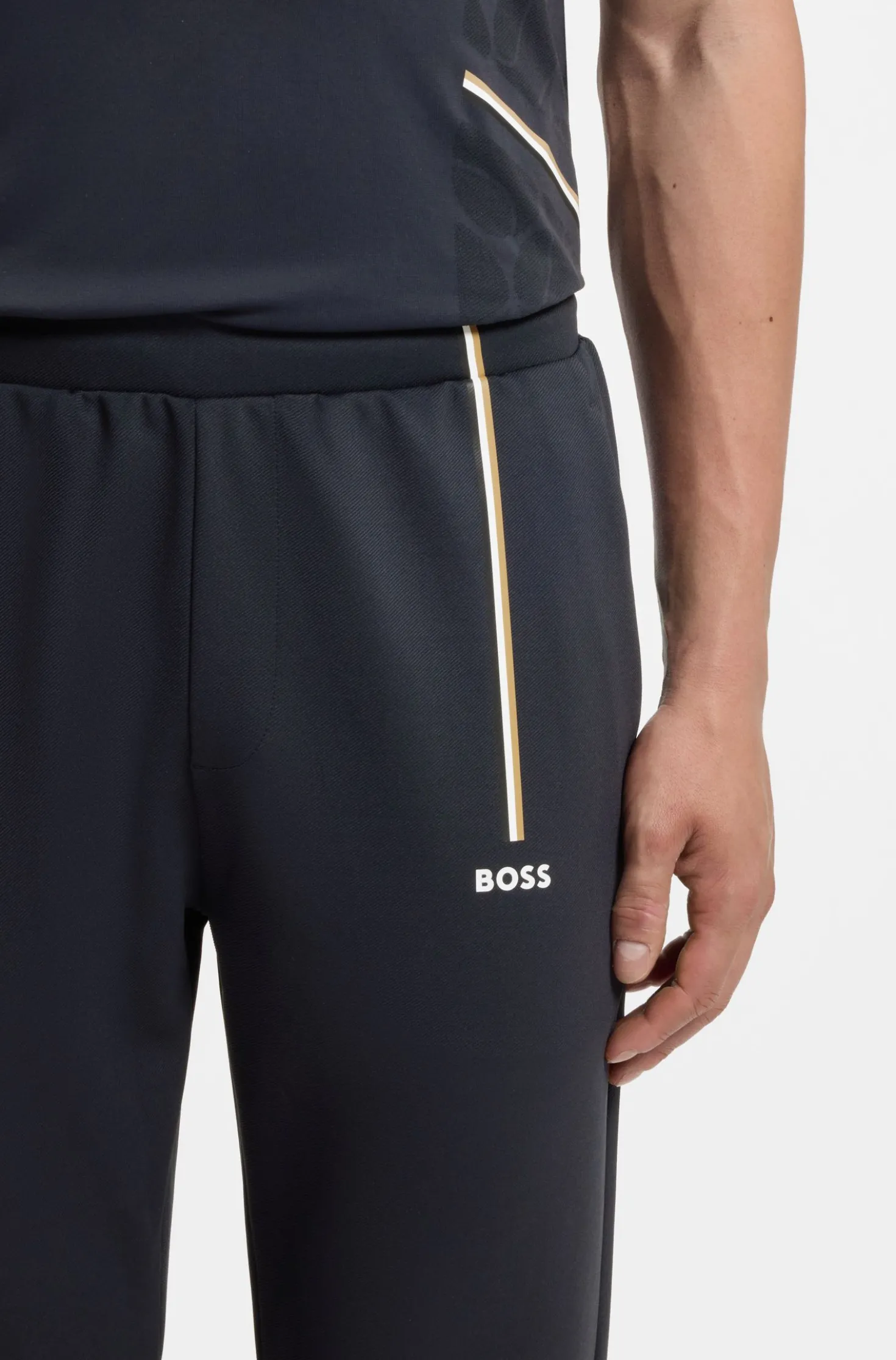 Active tracksuit bottoms in thermoregulating stretch gabardine