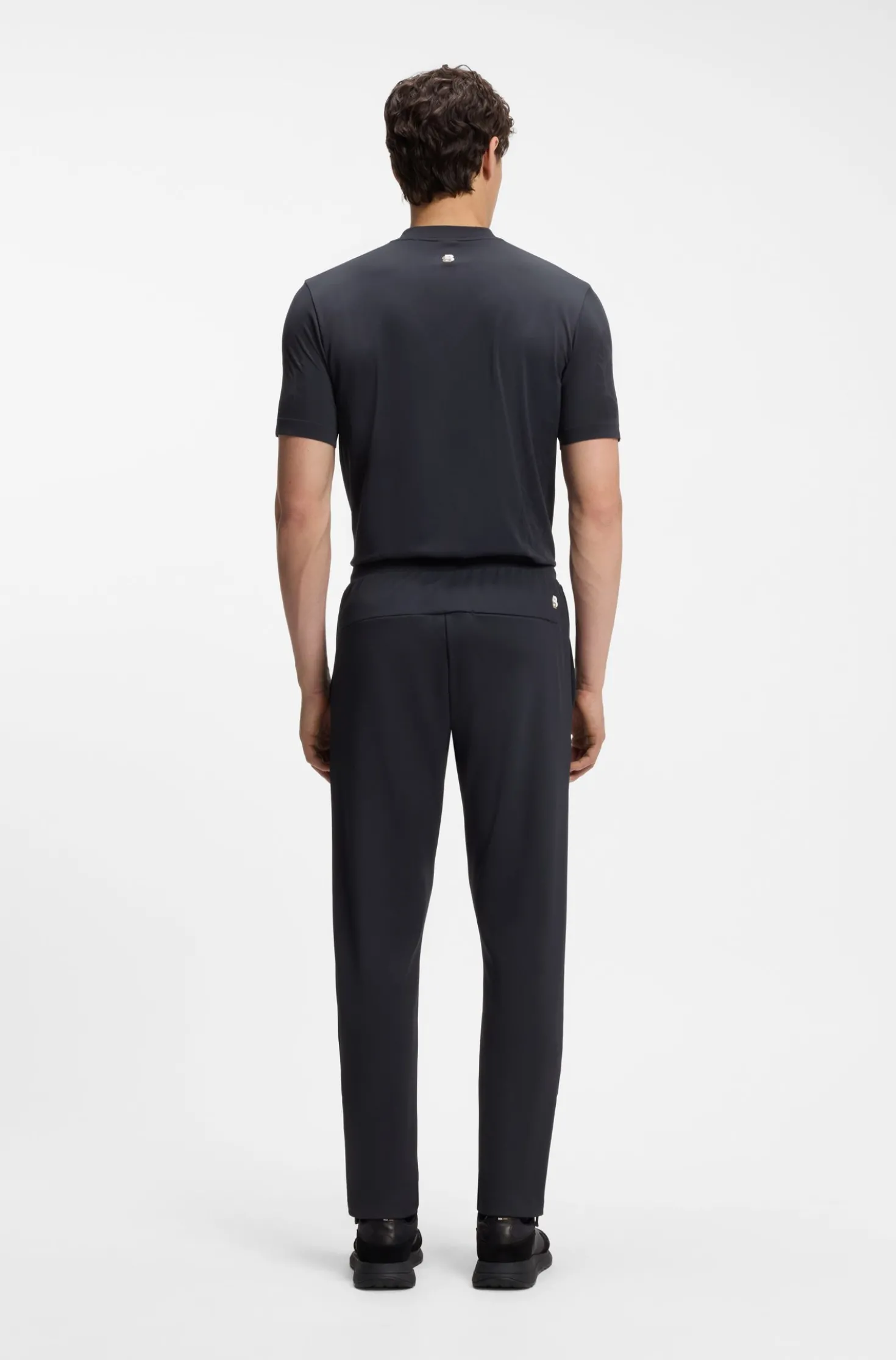Active tracksuit bottoms in thermoregulating stretch gabardine