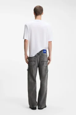 Baggy-fit black jeans with carpenter details