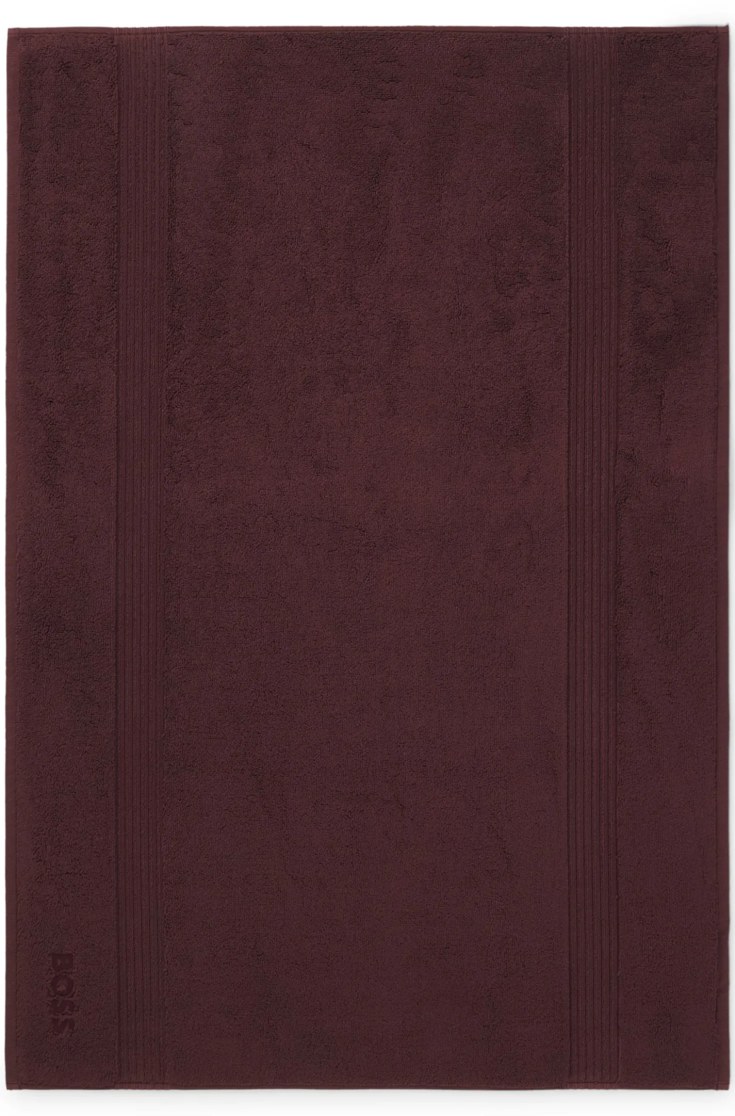 Cotton bath mat with embroidered logo