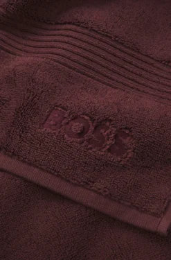Cotton bath mat with embroidered logo