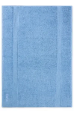 Cotton bath mat with embroidered logo