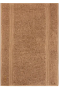Cotton bath mat with embroidered logo