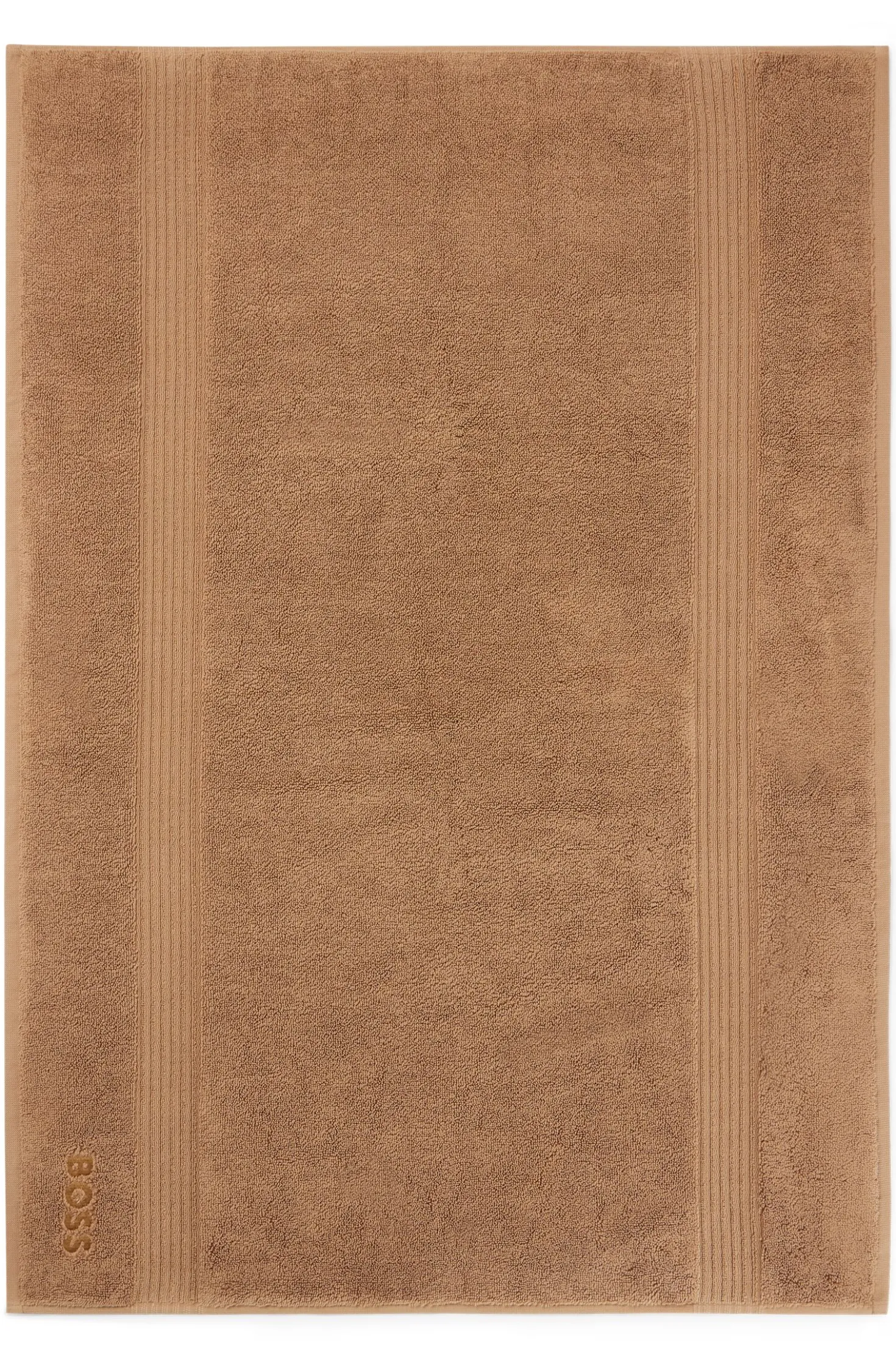 Cotton bath mat with embroidered logo
