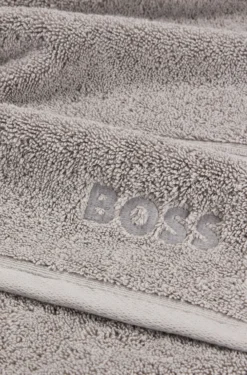Cotton bath towel in silver with embroidered logo