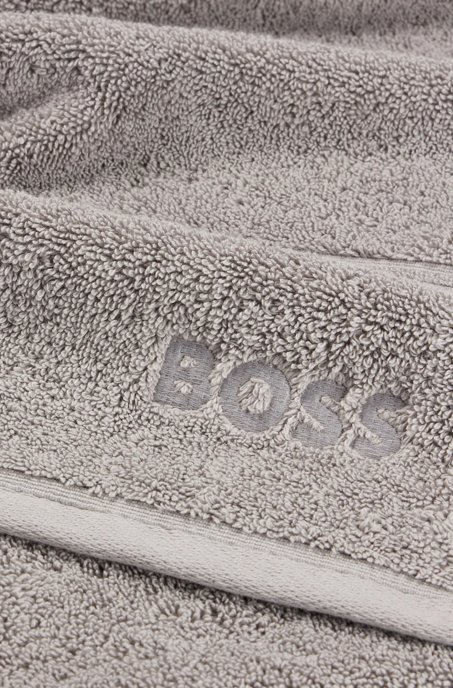 Cotton bath towel in silver with embroidered logo