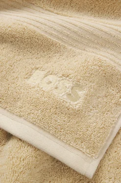 Cotton bath towel with tonal embroidered logo