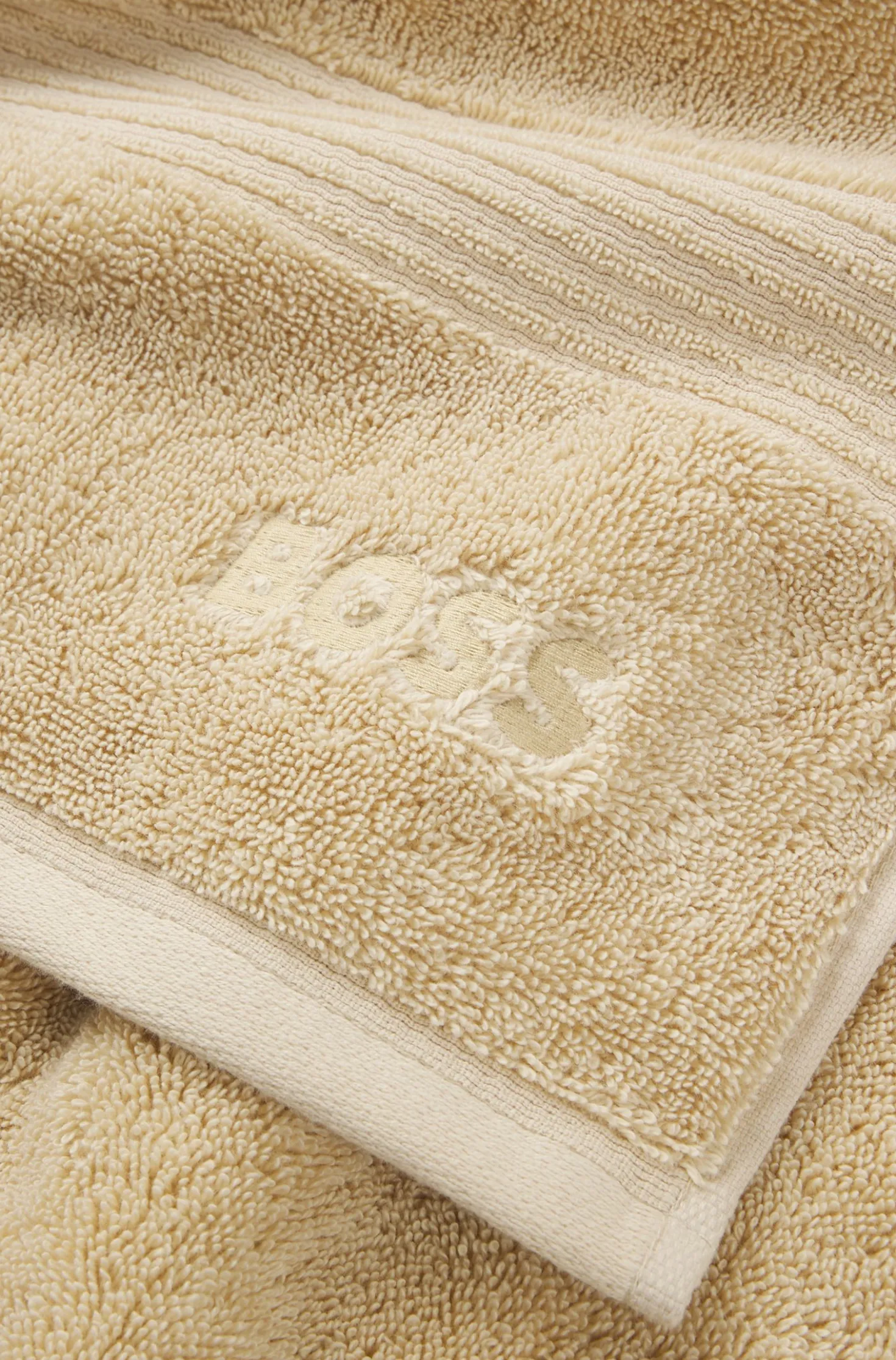 Cotton bath towel with tonal embroidered logo