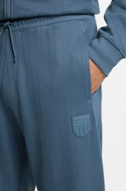 Cotton-blend tracksuit bottoms with drop-needle stripe