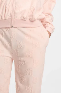 Cotton-blend tracksuit bottoms with all-over logo pattern