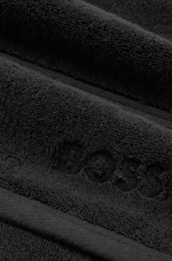 Cotton guest towel in black with embroidered logo