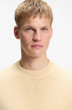 Cotton sweater with ribbed side seams
