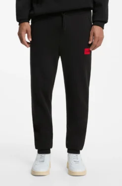Cotton-terry tracksuit bottoms with red logo label