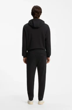 Cotton-terry tracksuit bottoms with red logo label
