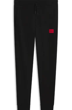 Cotton-terry tracksuit bottoms with red logo label