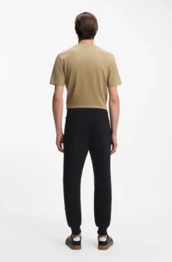 Cotton-terry tracksuit bottoms with signature stripes