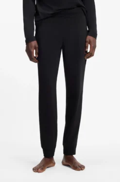 Cuffed loungewear bottoms in stretch cotton with logo print