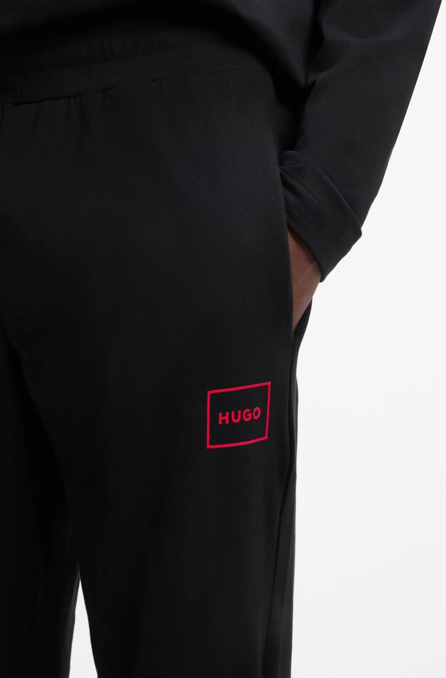 Cuffed loungewear bottoms in stretch cotton with logo print