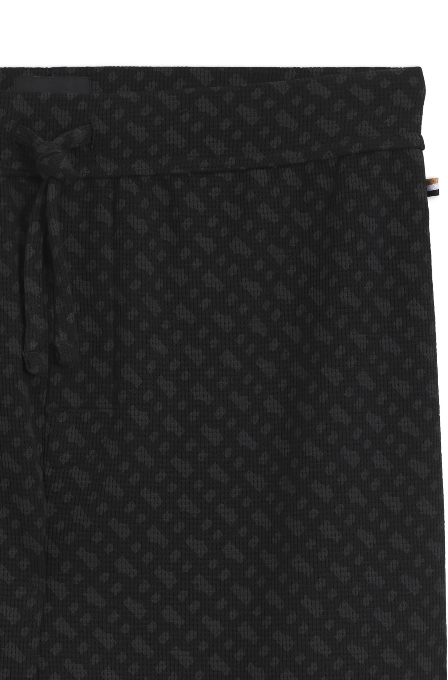 Cuffed pyjama bottoms in monogram-print waffle fabric