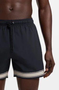Drawstring swim shorts in stretch fabric with tape trim