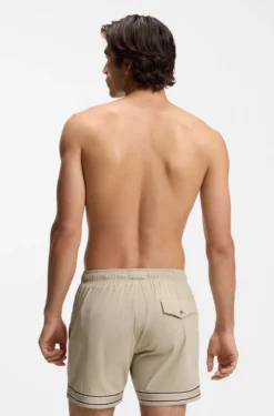 Drawstring swim shorts in stretch fabric with tape trim