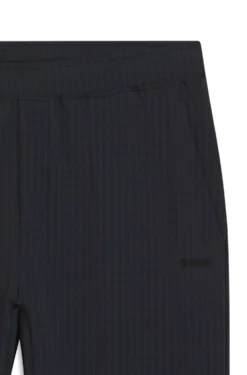 Drawstring trousers in stretch waffle fabric with framed zip
