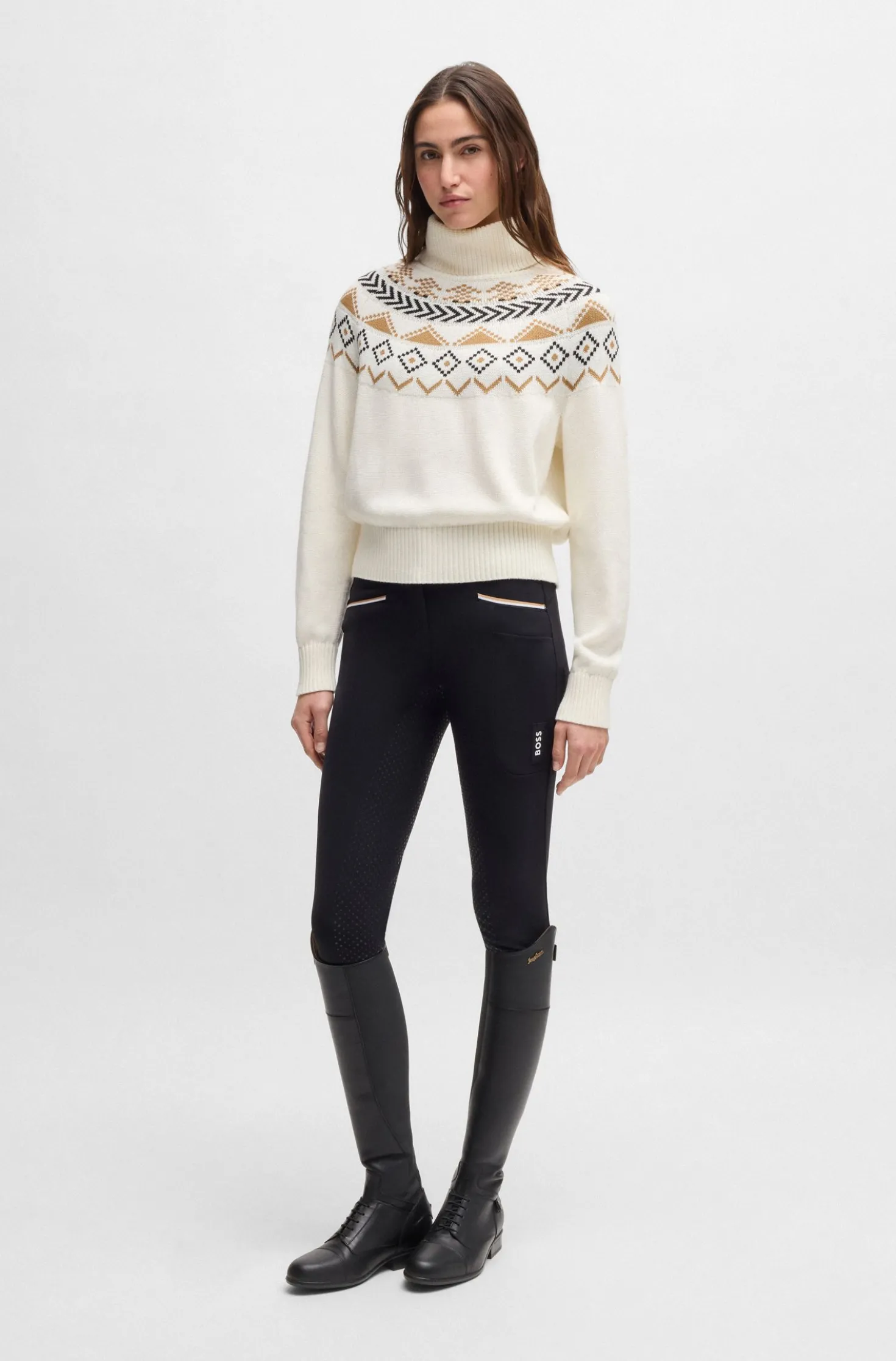 Equestrian rollneck sweater with knitted pattern