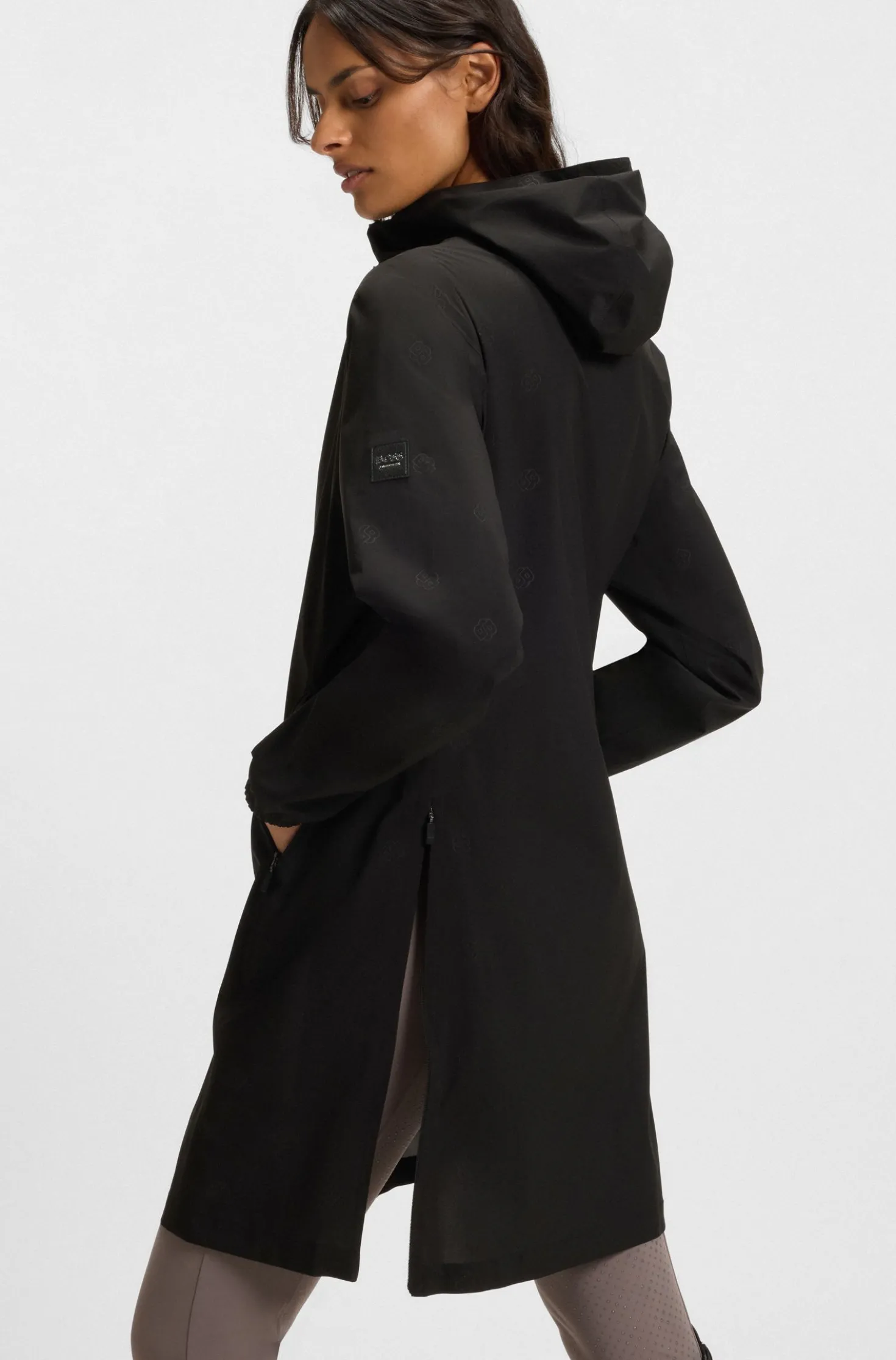Equestrian waterproof raincoat with adjustable rear zips