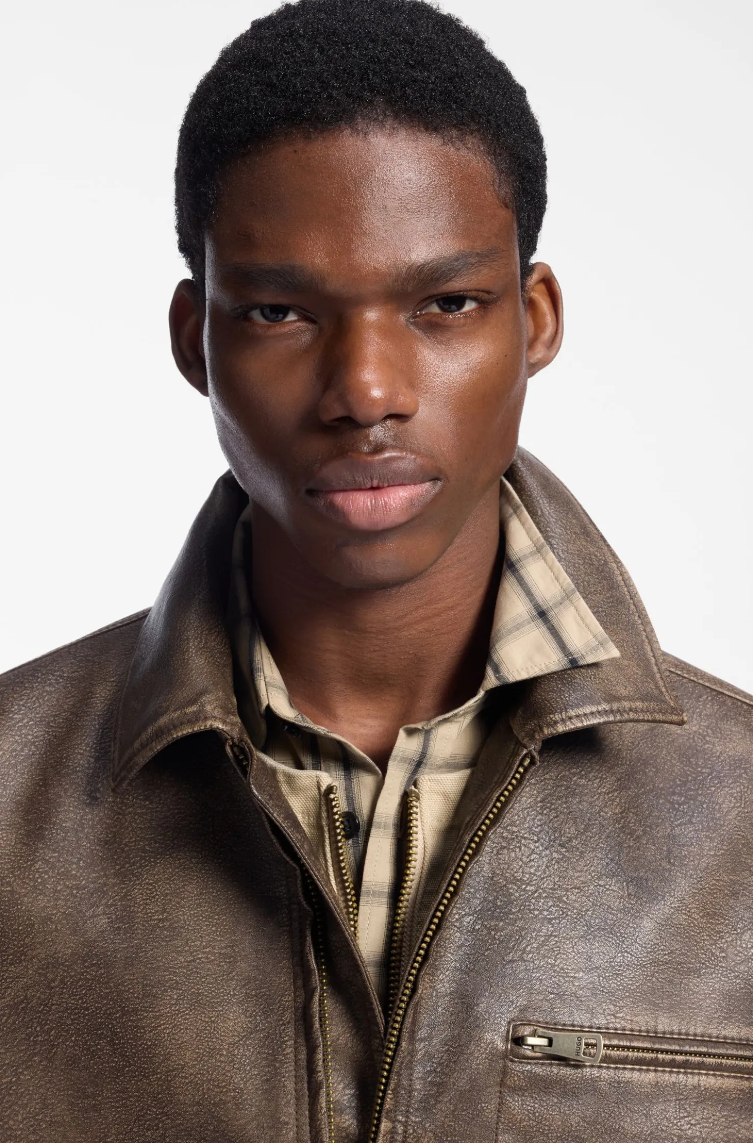 Faux-leather jacket with cross-shaped zip-puller