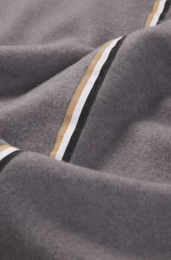 Fleece throw with signature-stripe ribbon