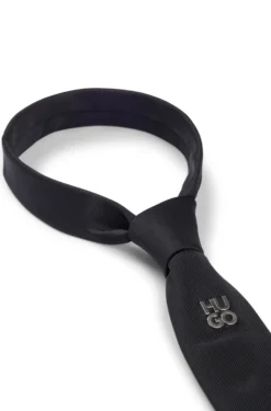 Jacquard-woven tie with metallic stacked-logo trim