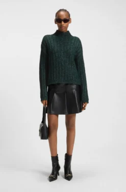 Knitted sweater with ribbed structure
