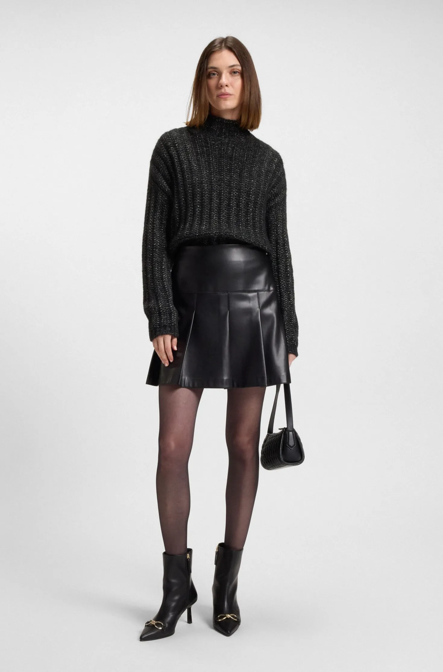 Knitted sweater with ribbed structure