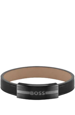 Leather cuff with enamel-filled logo plate