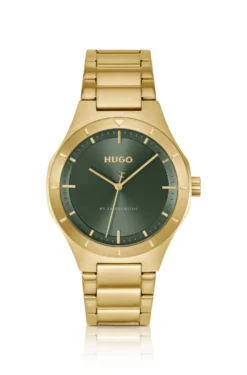 Lit gold-tone watch with green dial