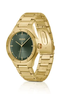 Lit gold-tone watch with green dial