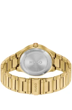 Lit gold-tone watch with green dial