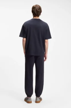 Loose-fit T-shirt in cotton with suede logo badge
