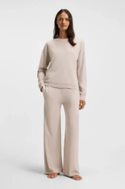 Melange-jersey tracksuit bottoms with logo plate