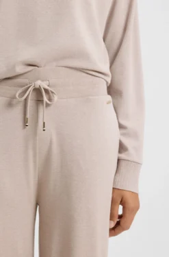 Melange-jersey tracksuit bottoms with logo plate