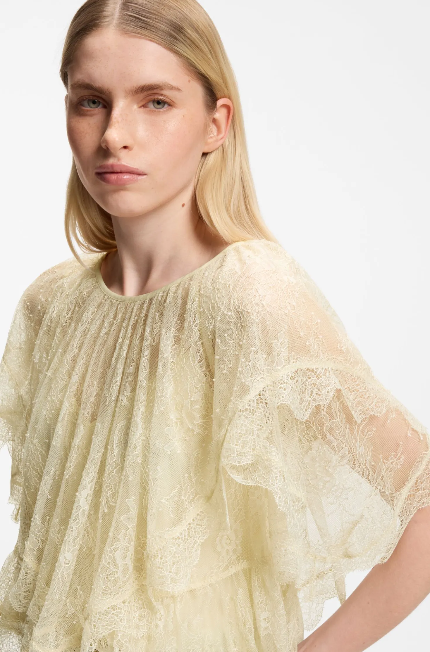 Mini cape blouse with lace trimmings
