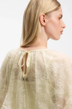 Mini cape blouse with lace trimmings