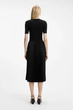 Mixed-material dress with plissé skirt