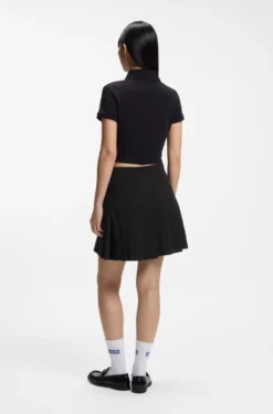 Pleated skirt in stretch cotton with integrated shorts