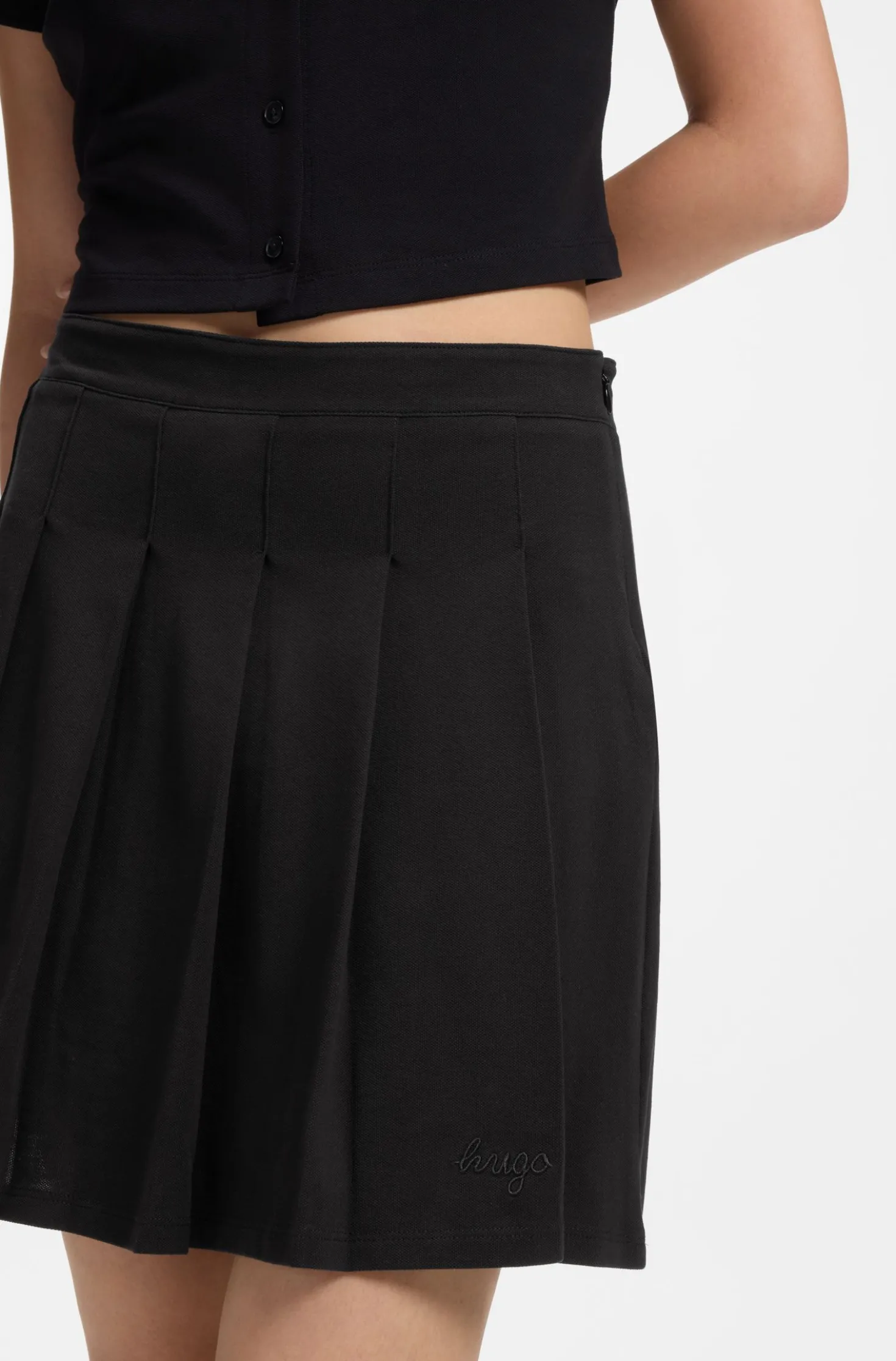 Pleated skirt in stretch cotton with integrated shorts