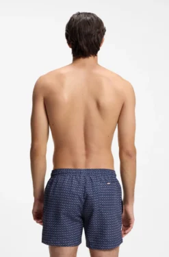 Printed swim shorts with logo badge