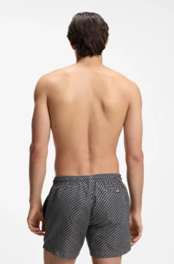 Printed swim shorts with logo badge