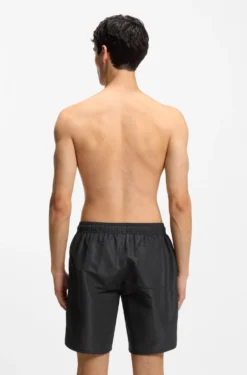 Quick-dry swim shorts with spray-effect logo