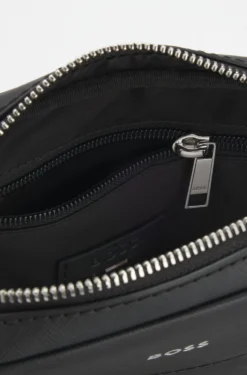 Recycled-leather reporter bag with adjustable logo strap